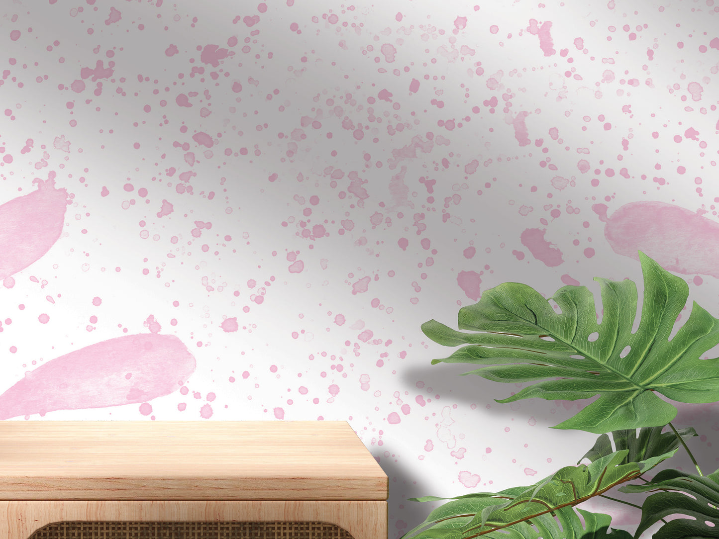 a wooden table with a plant on top of it, set against a wall with a pink and white speckled pattern.