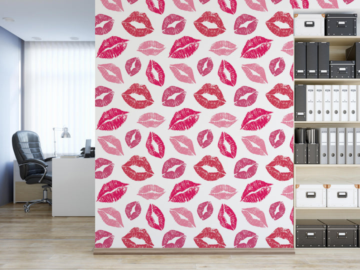 a wall with a repeating pattern of pink lips on a white background.