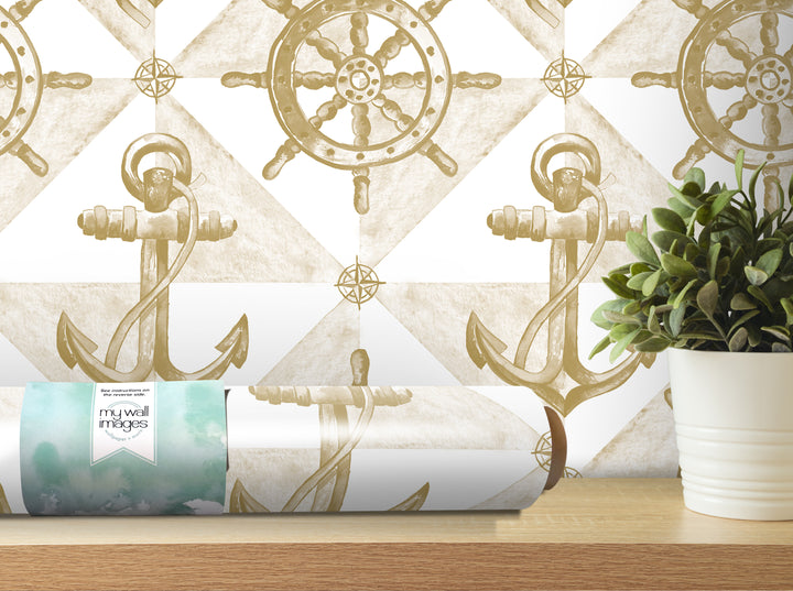 a wallpapered wall with a repeating pattern of anchors and a ship's wheel, along with a potted plant and a roll of wallpaper on a shelf.