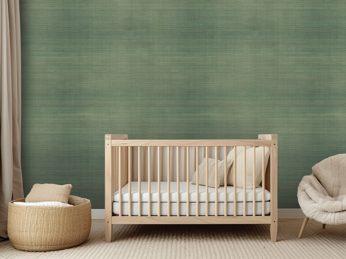 a modern nursery room with a wooden crib, a woven basket, and a plush chair. The room has a textured green wall and a neutral color scheme.