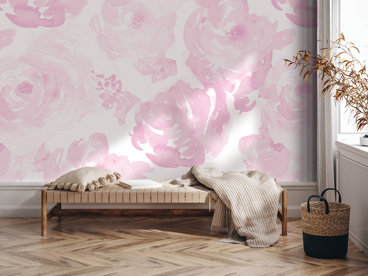 a cozy and inviting living space with a wooden floor and a bench adorned with a throw blanket and a pillow. The wall behind the bench is decorated with a large, vibrant pink floral pattern, creating a warm and cheerful atmosphere. A woven basket is placed next to the bench, and a potted plant is situated nearby, adding a touch of greenery to the space.