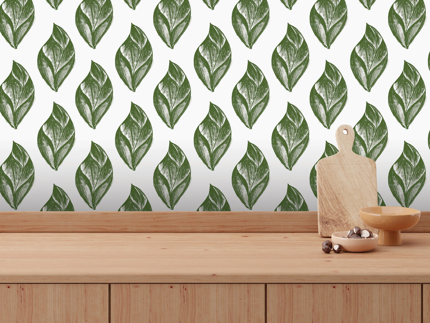a wooden table with a wooden cutting board and a bowl of food placed on it. The table is set against a wall with a repeating pattern of green leaf designs.