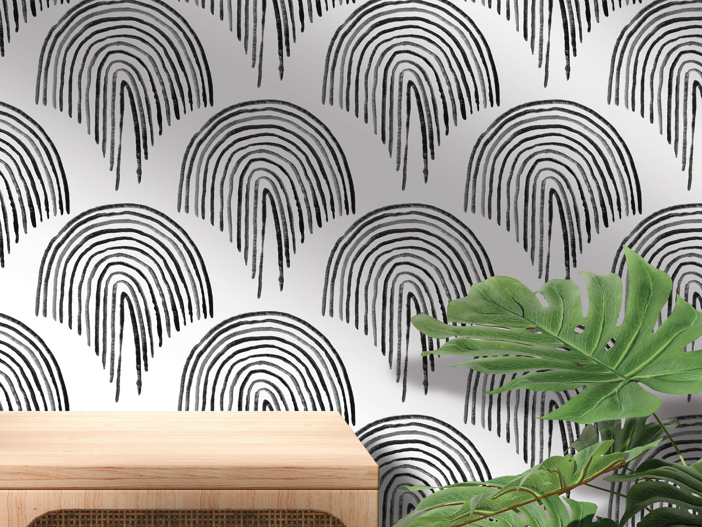 a wall with a repeating pattern of black and white arches, creating a visually striking and modern design. In the foreground, there is a wooden table and a large green plant, adding a touch of nature and warmth to the scene.