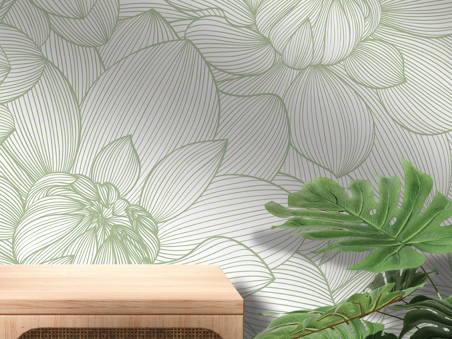 a wallpapered wall with a wooden table in the foreground, and a plant with large leaves in the background.