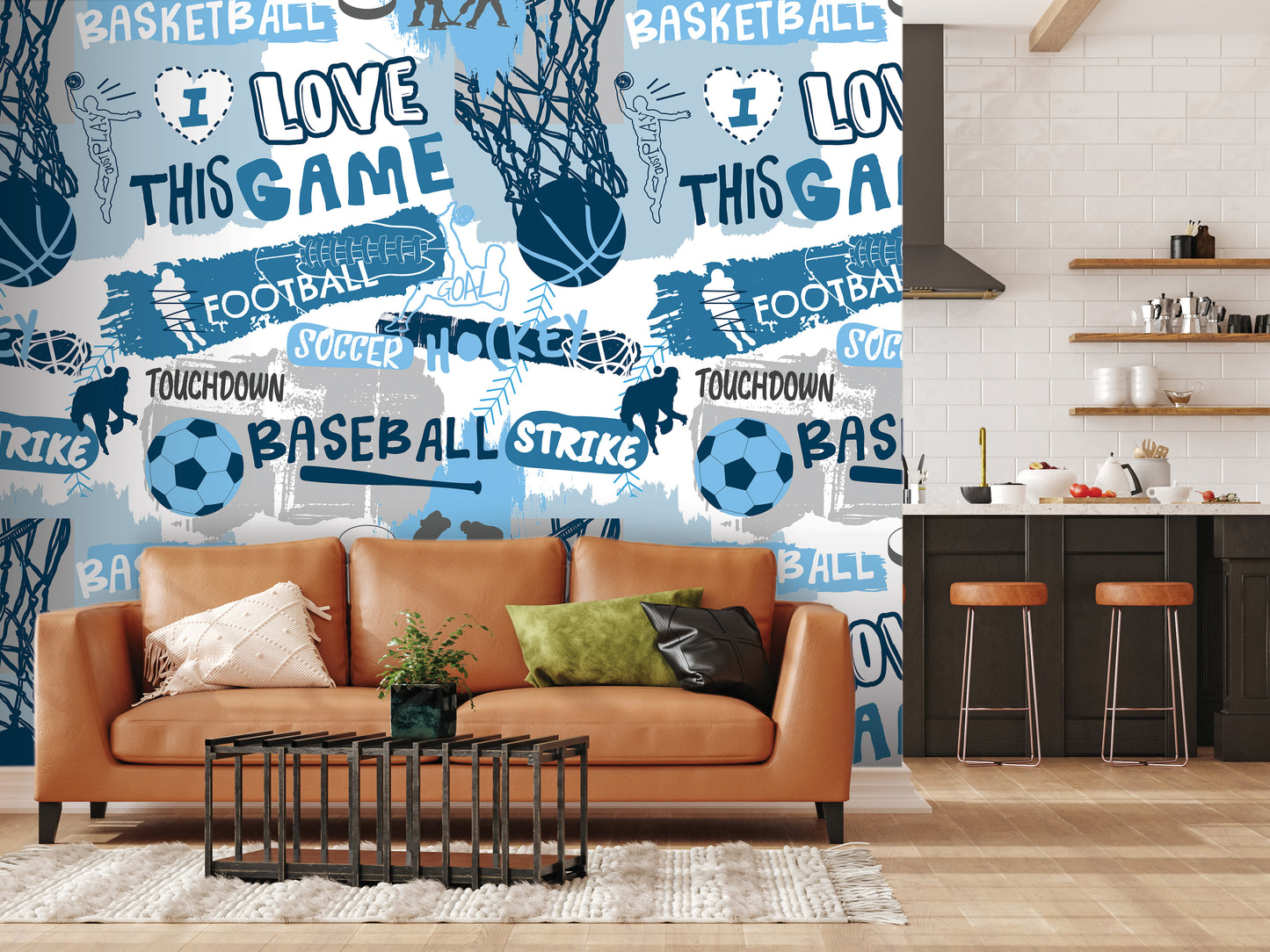 a living room with a brown leather couch, a coffee table, and a kitchen counter with stools. The wall behind the couch is covered in a collage of various sports-related words and images, including "BASKETBALL", "FOOTBALL", "SOCcer", "HOCKEY", "TOUCHDOWN", "BASEBALL", "STRIKE", and "BALL".