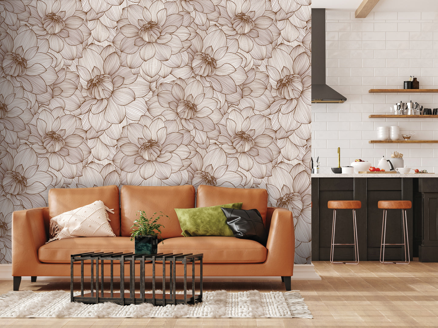 a modern living room with a large floral wallpaper on the wall behind a brown leather sofa. The sofa is adorned with two throw pillows, one green and one black. In front of the sofa, there is a black coffee table with a plant on it. The room also includes a kitchen area with a countertop and stools, as well as a rug on the floor.