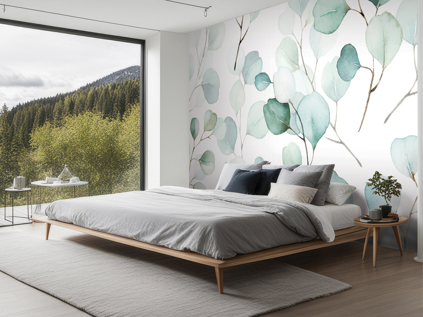 a modern bedroom with a large bed, a nightstand, and a large window overlooking a forested area.