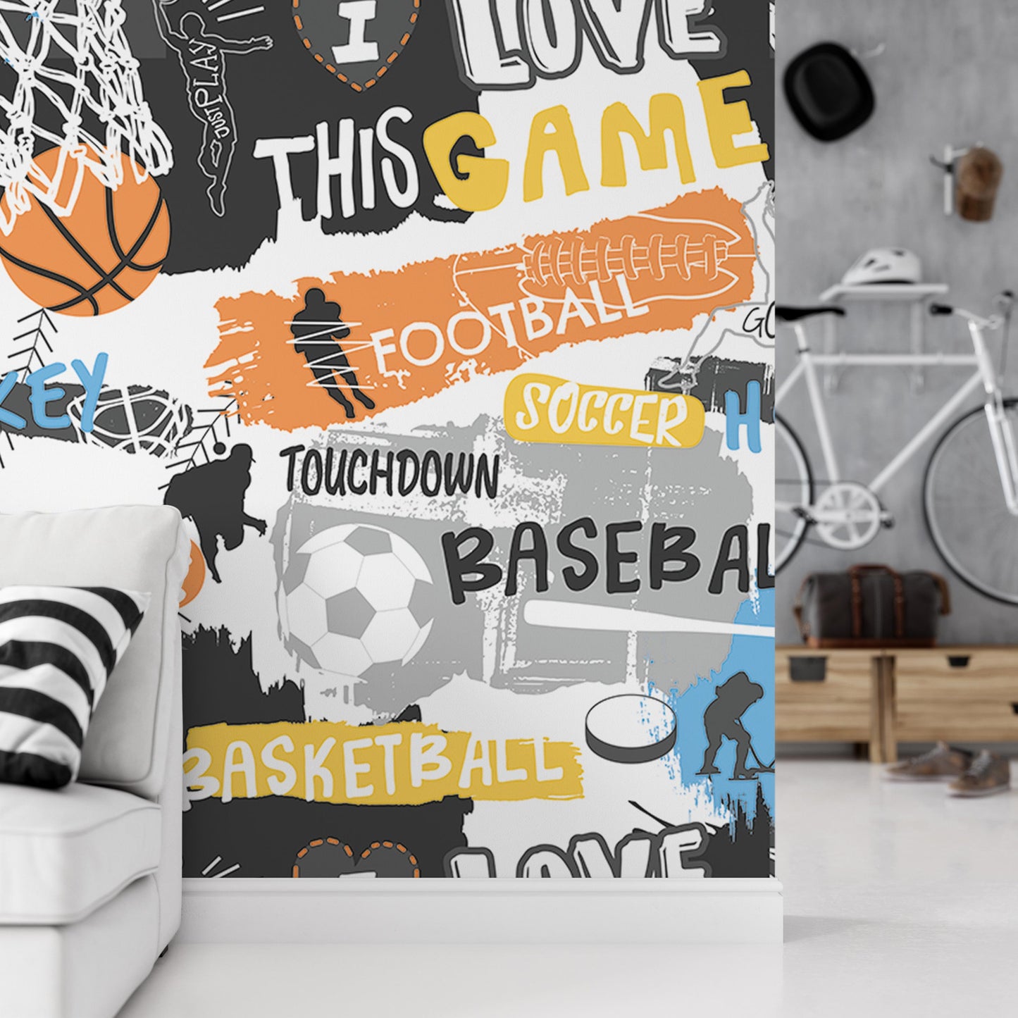 a wall with a collage of various sports-related words and phrases, including "I LOVE THIS GAME", "FOOTBALL", "SOCcer", "TOUGHDOWN", "BASEBALL", "BASKETBALL", and "H". The wall is decorated with a mix of text and illustrations related to sports, creating a vibrant and energetic atmosphere.