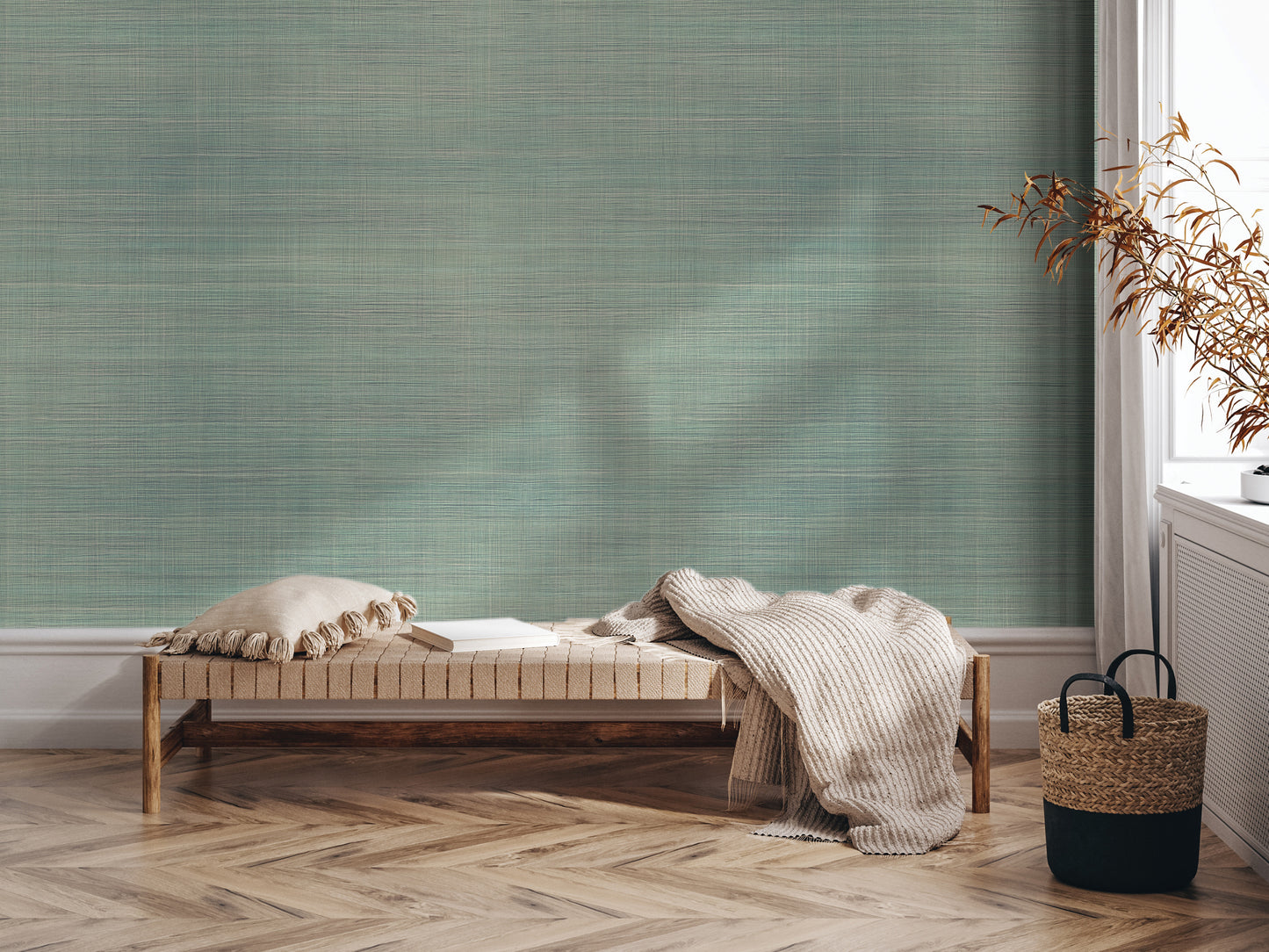 a cozy corner with a wooden bench, a woven basket, and a plant, all set against a textured green wall.