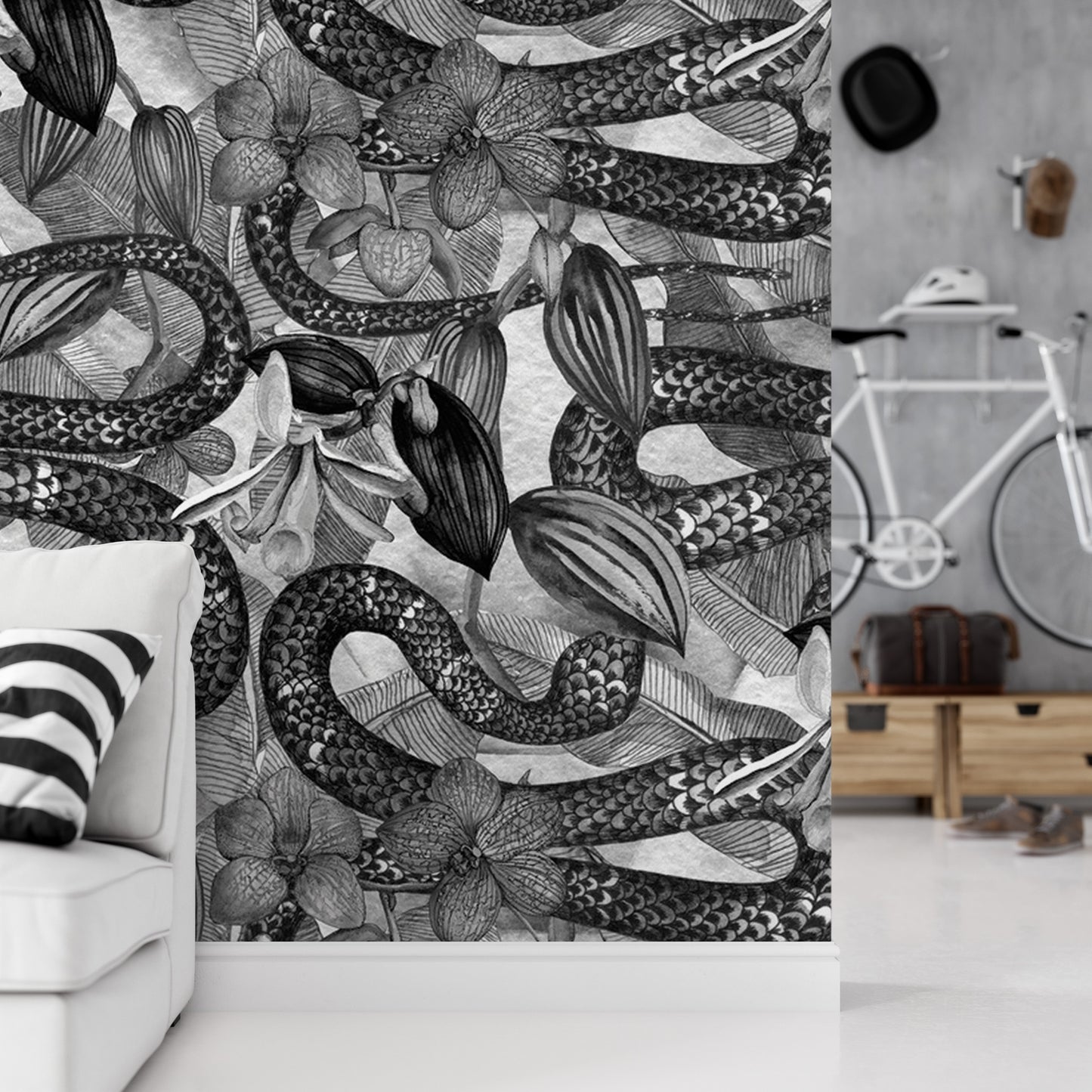 a wallpapered wall with a black and white snake design, along with various floral elements. In the background, there is a bicycle and a wooden shelf.