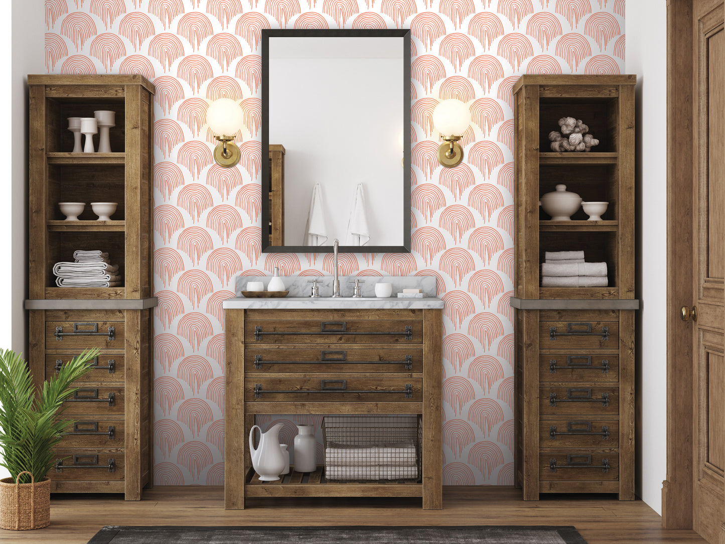 a bathroom with a wooden vanity, a mirror, and two wooden cabinets. The walls are decorated with a pink and white patterned wallpaper, and there are two potted plants in the room.