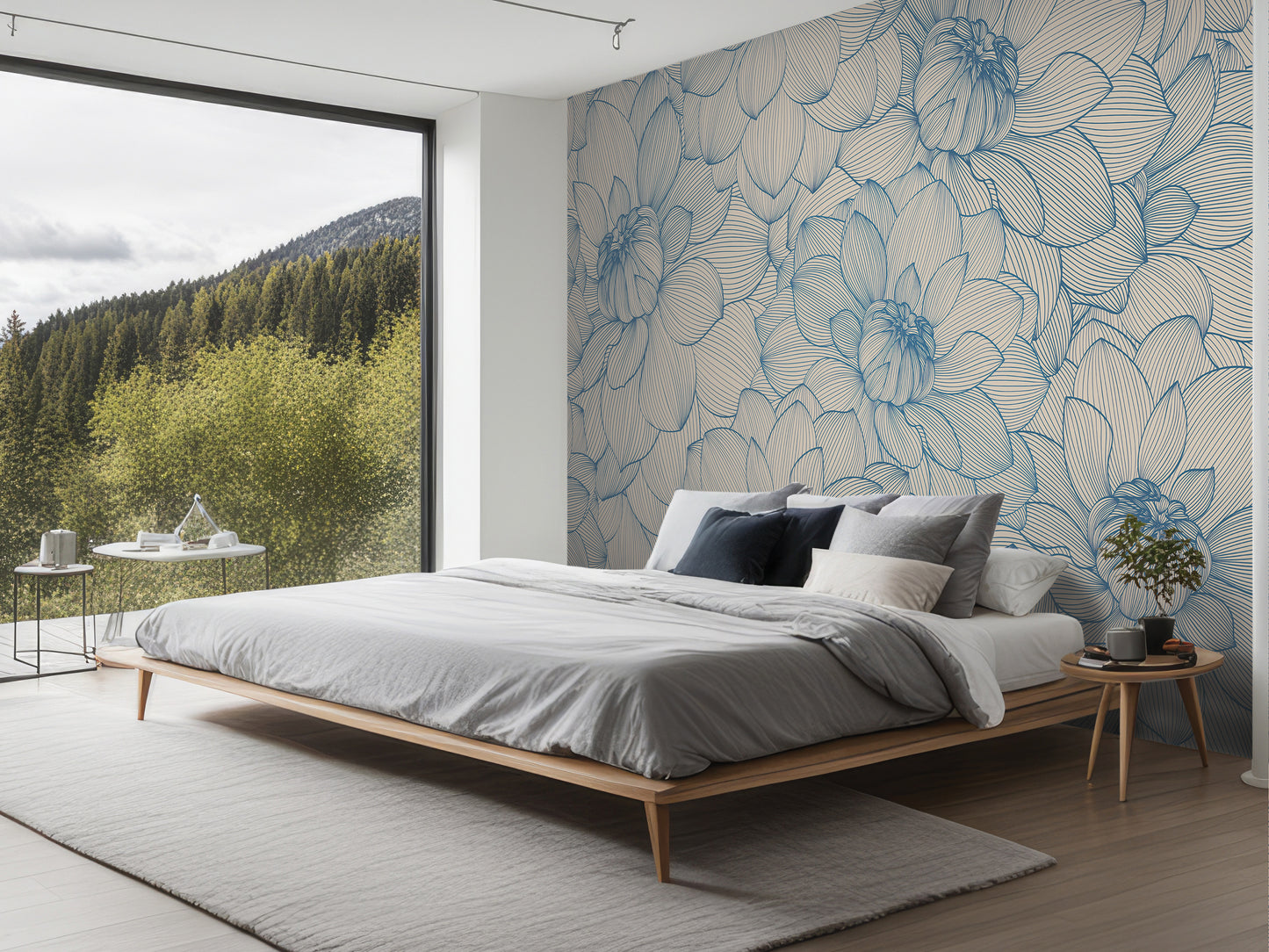 a modern bedroom with a large bed, a nightstand, and a large window overlooking a forested area.