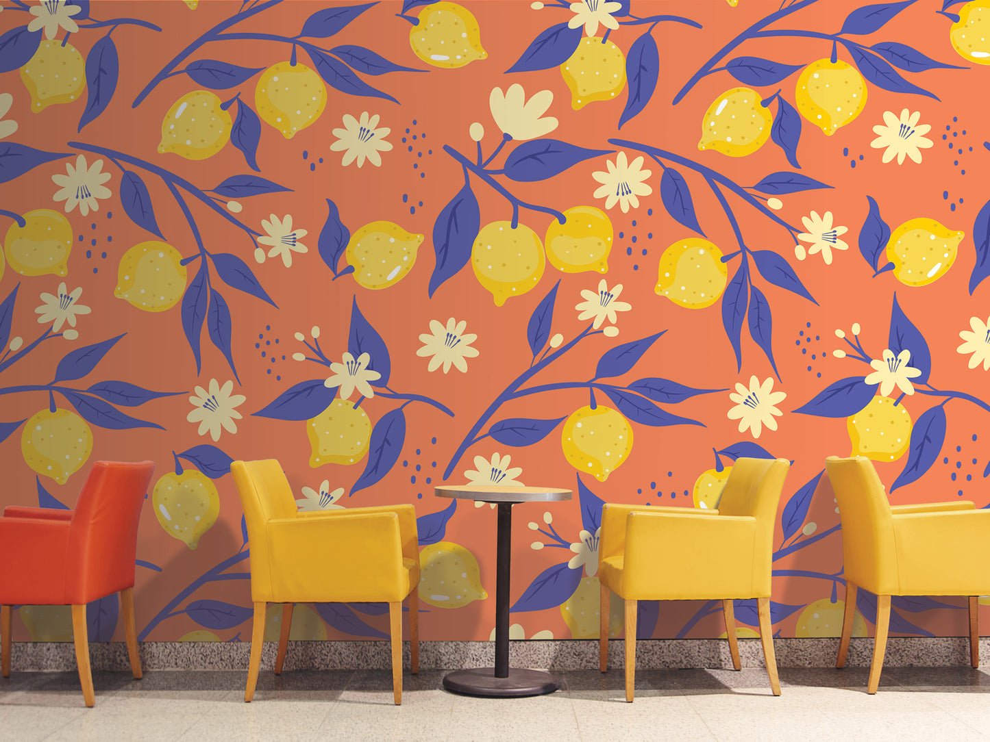 a vibrant and colorful wall with a repeating pattern of yellow lemons and blue leaves. In front of the wall, there are four yellow chairs arranged in a row, creating a cozy seating area.