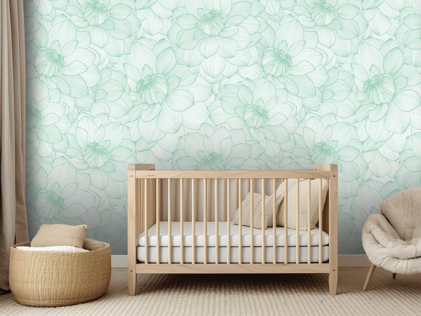 a nursery room with a wooden crib, a woven basket, and a plush chair. The walls are covered in a light green floral wallpaper, creating a serene and calming atmosphere.