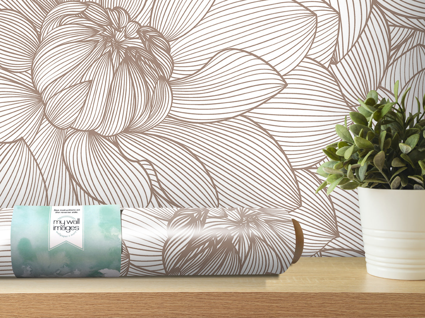 a wallpapered wall with a large floral pattern, a potted plant, and a roll of wallpaper on a shelf.