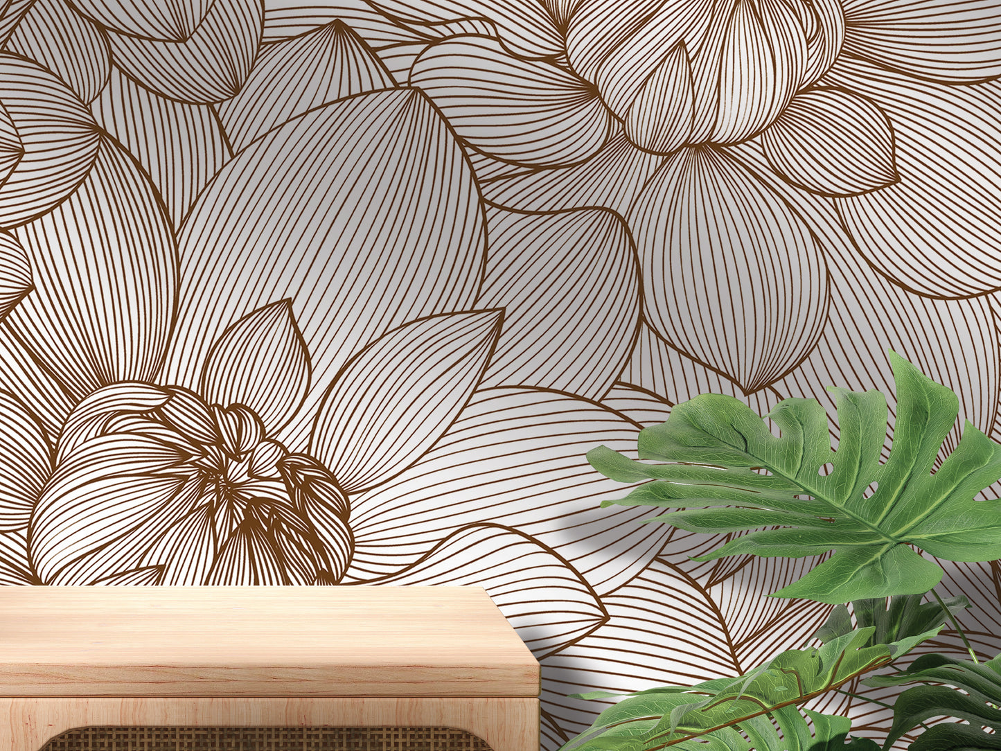 a wallpapered wall with a brown floral pattern, a wooden table, and some green plants.