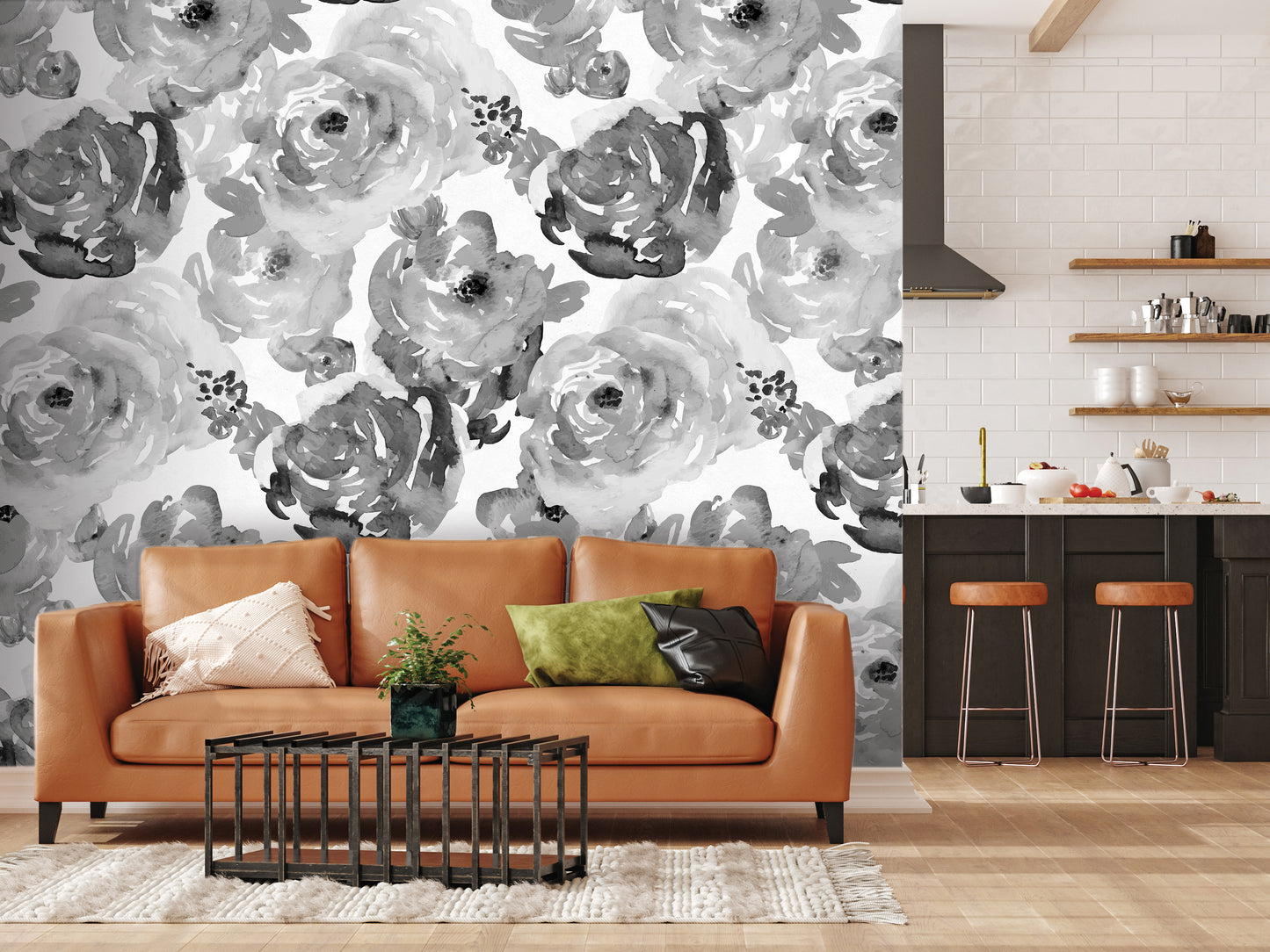 a modern living room with a large floral wallpaper on the wall behind a brown leather sofa. The sofa is accompanied by a coffee table and a rug, creating a cozy and inviting atmosphere. In the background, there is a kitchen area with a countertop and a shelf holding various kitchen items.