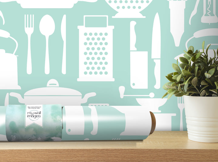 a kitchen-themed wallpaper with various kitchen utensils and appliances, such as a knife, spoon, and grater, as well as a potted plant.