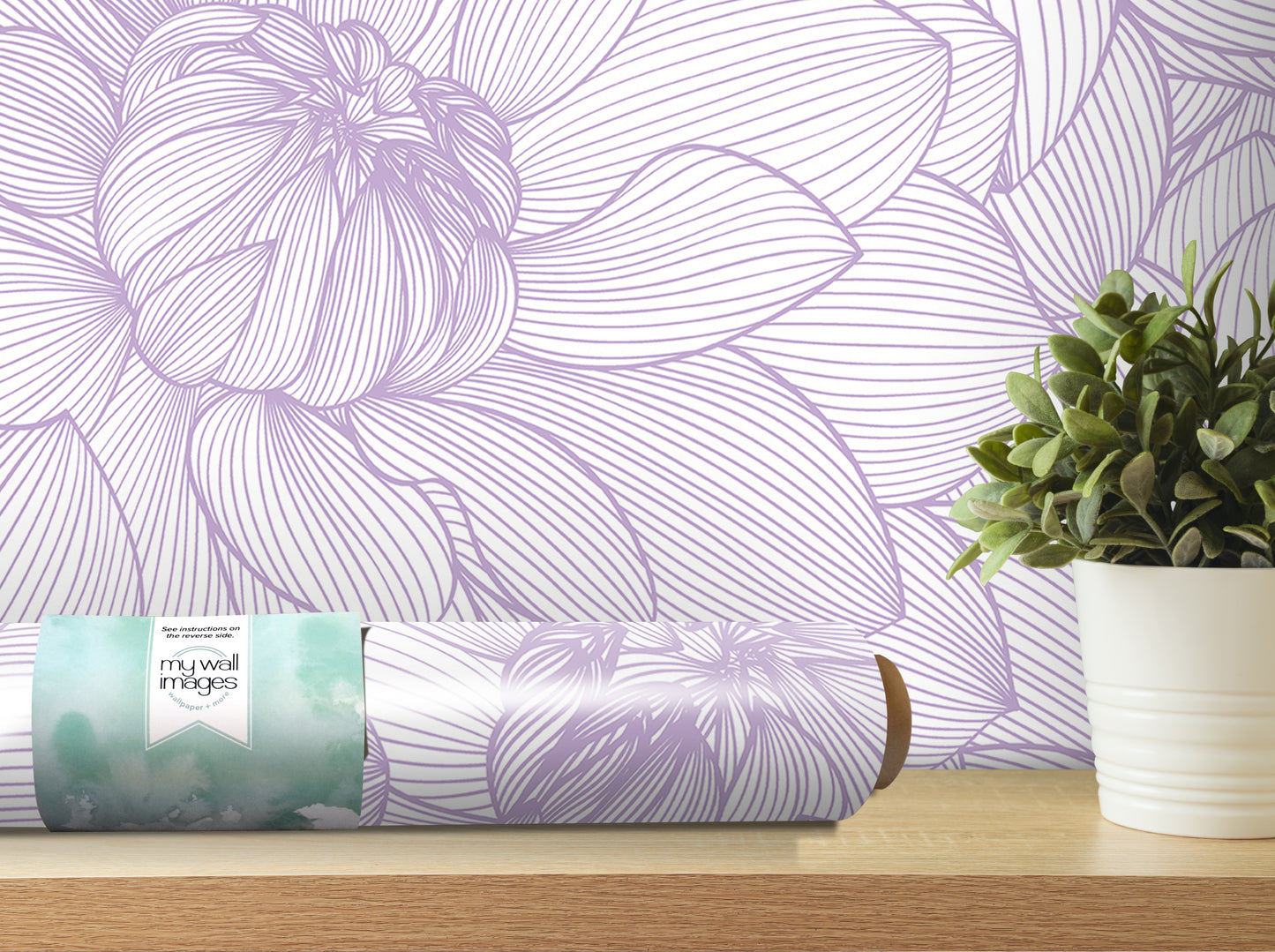 a purple and white floral wallpaper on the wall, with a potted plant and a roll of wallpaper on a shelf in the foreground.