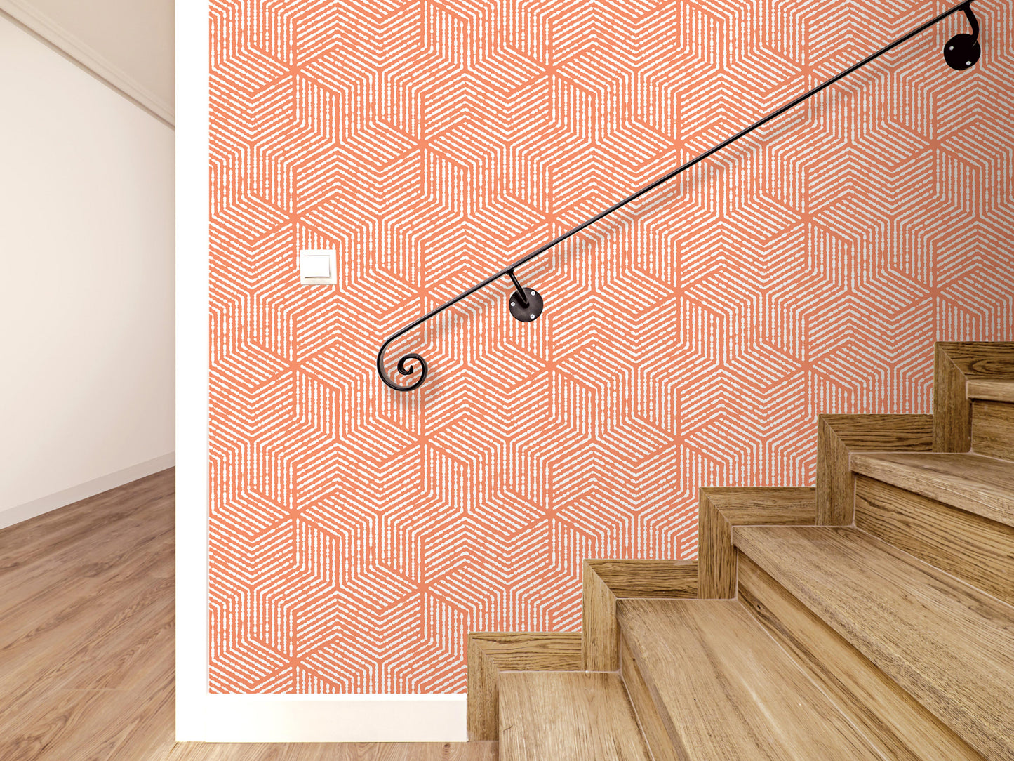 a staircase with wooden steps and a black metal handrail, set against a wall with a geometric orange and white pattern.