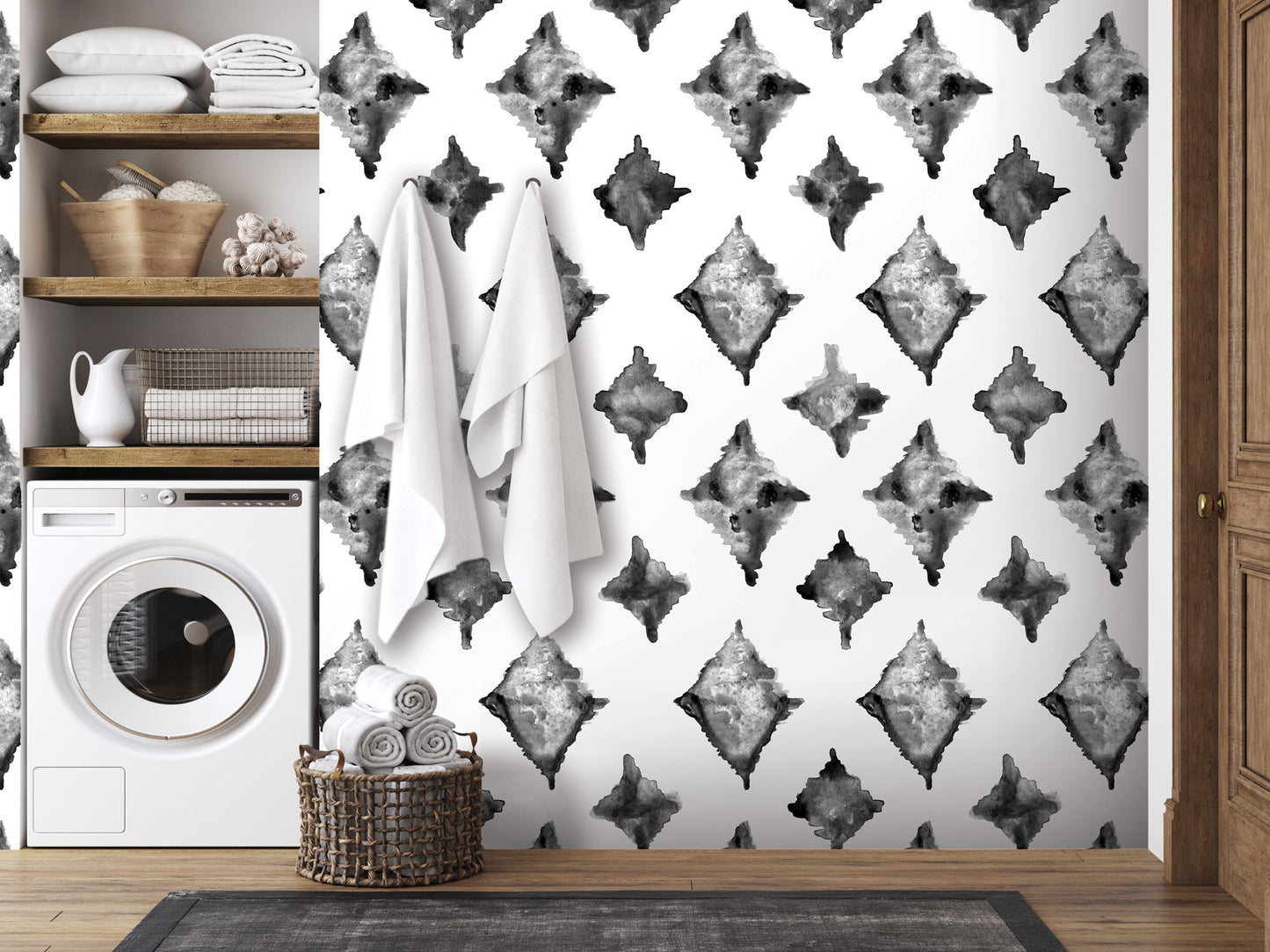 a bathroom with a black and white patterned wallpaper, a washing machine, and a basket of towels.