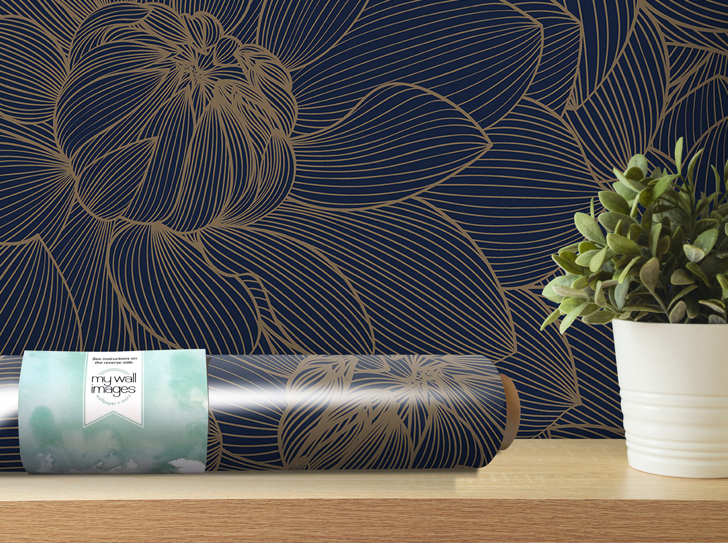 a dark blue wall with a gold floral pattern, a roll of wallpaper, a potted plant, and a wooden shelf.