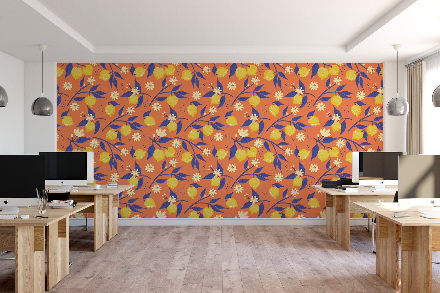 a modern office space with a large wall mural featuring a repeating pattern of orange and yellow flowers and leaves. The office has several desks and chairs, and the overall design has a bright and vibrant atmosphere.
