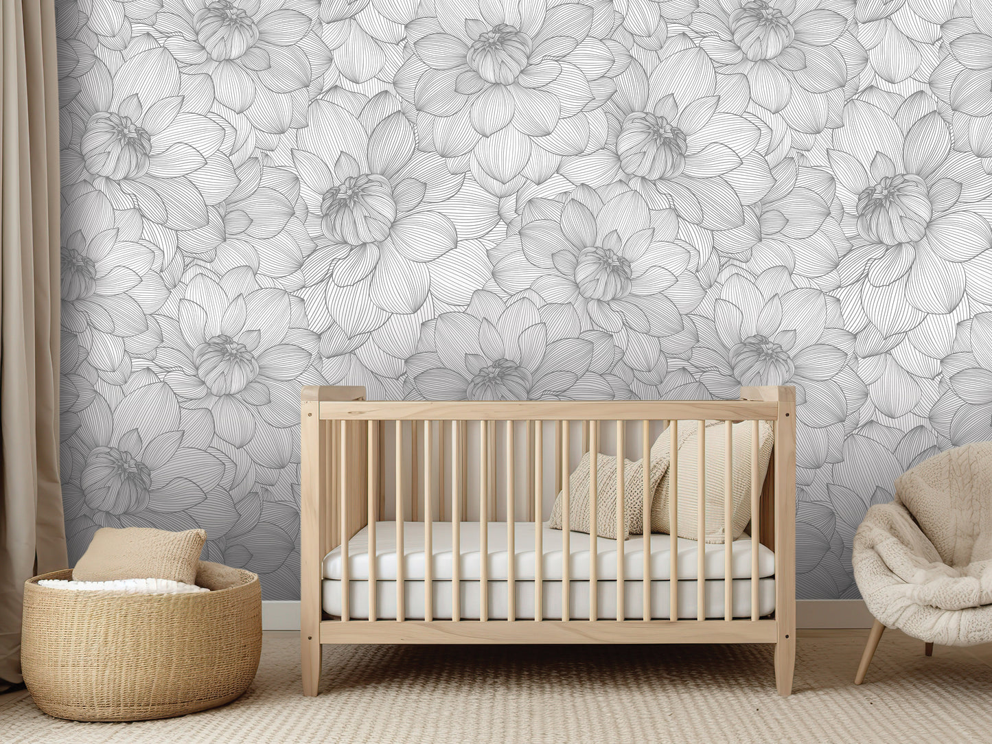 a nursery room with a wooden crib, a woven basket, and a plush chair. The room has a gray and white floral wallpaper covering the walls.