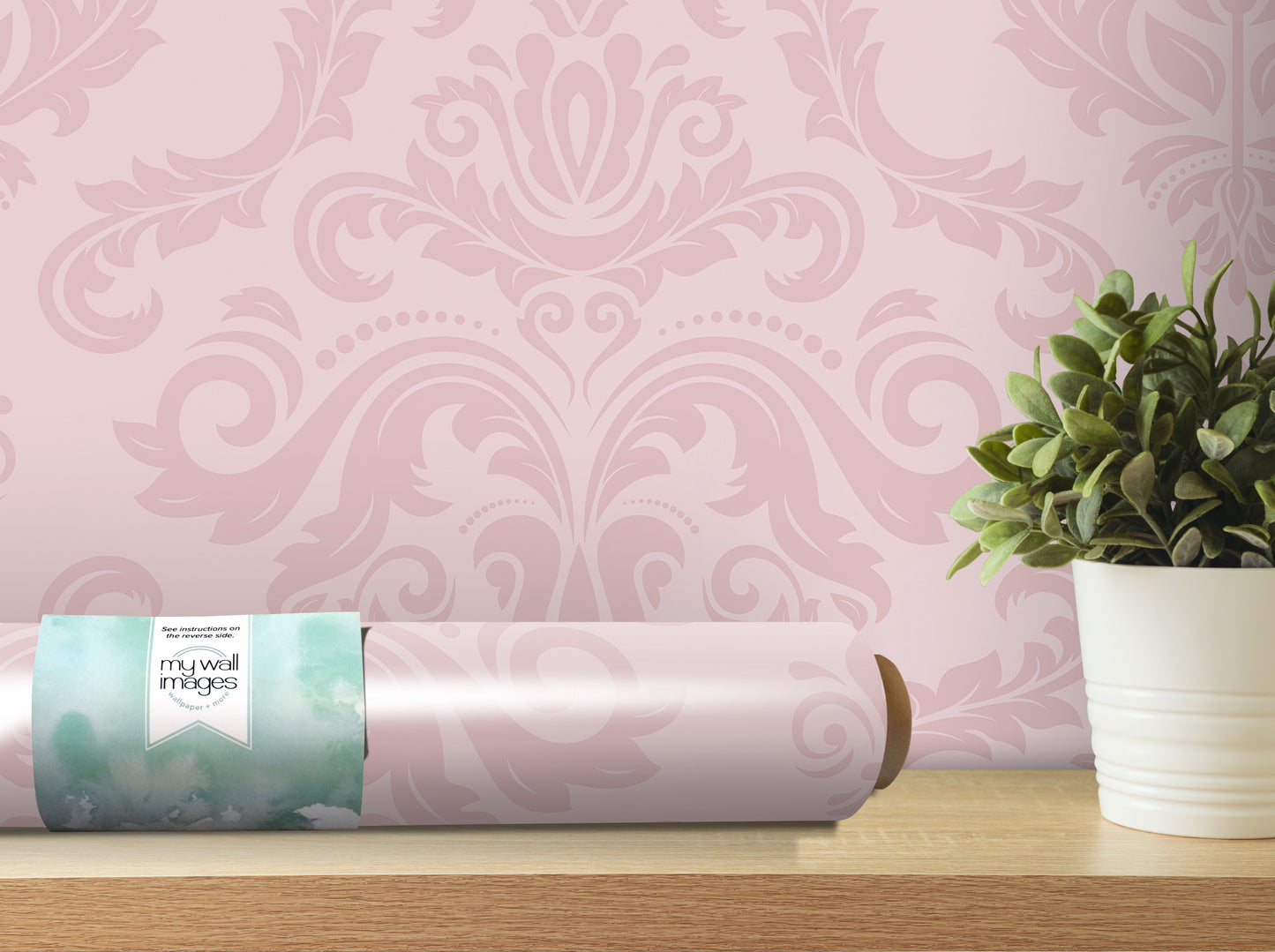 a pink wallpaper with a floral pattern, a roll of wallpaper paper, and a potted plant on a wooden shelf.