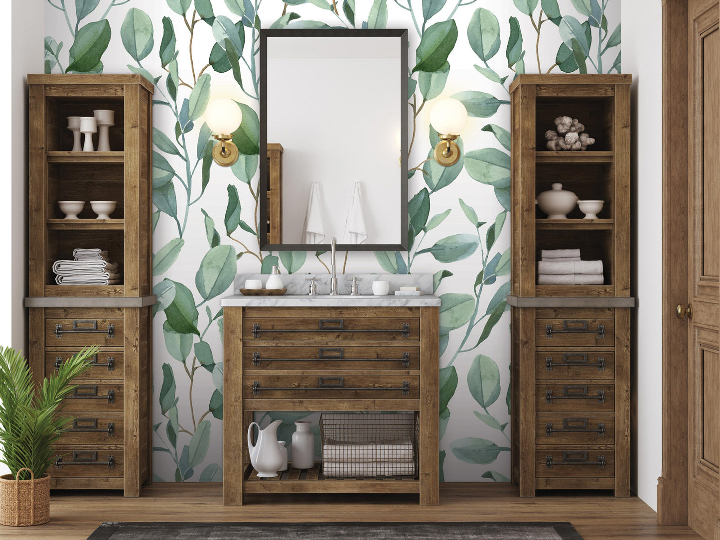 a bathroom with a wooden vanity, a mirror, and shelves. The walls are covered in a green leaf pattern wallpaper, and there are two wooden cabinets on either side of the vanity.