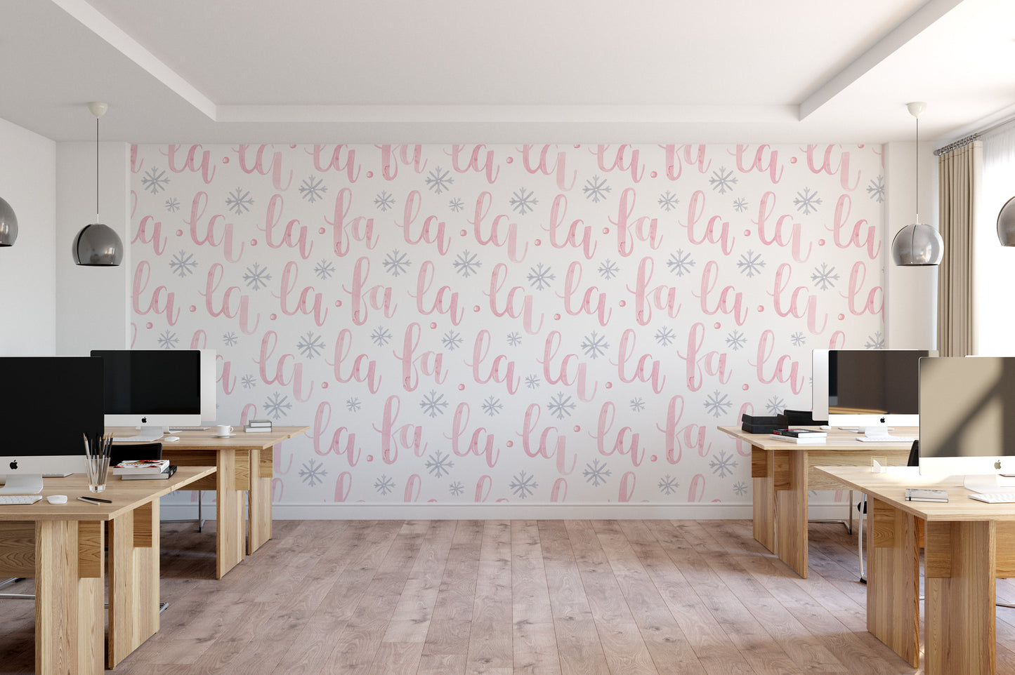 a modern office space with a large wall featuring a repeating pattern of pink and white text that says "la la la la la la la la la la". The office has several desks with computer monitors, and the floor is made of wood.