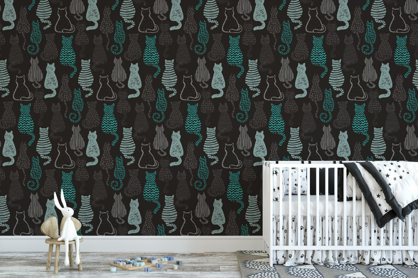 a nursery room with a crib and a small white rabbit figurine. The walls are decorated with a repeating pattern of black and teal cat silhouettes, creating a whimsical and playful atmosphere.