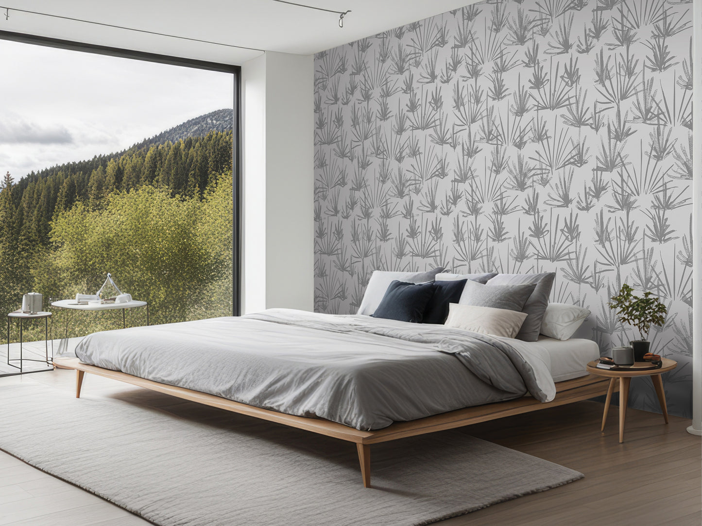 a modern bedroom with a large bed, a nightstand, and a window overlooking a forested area.