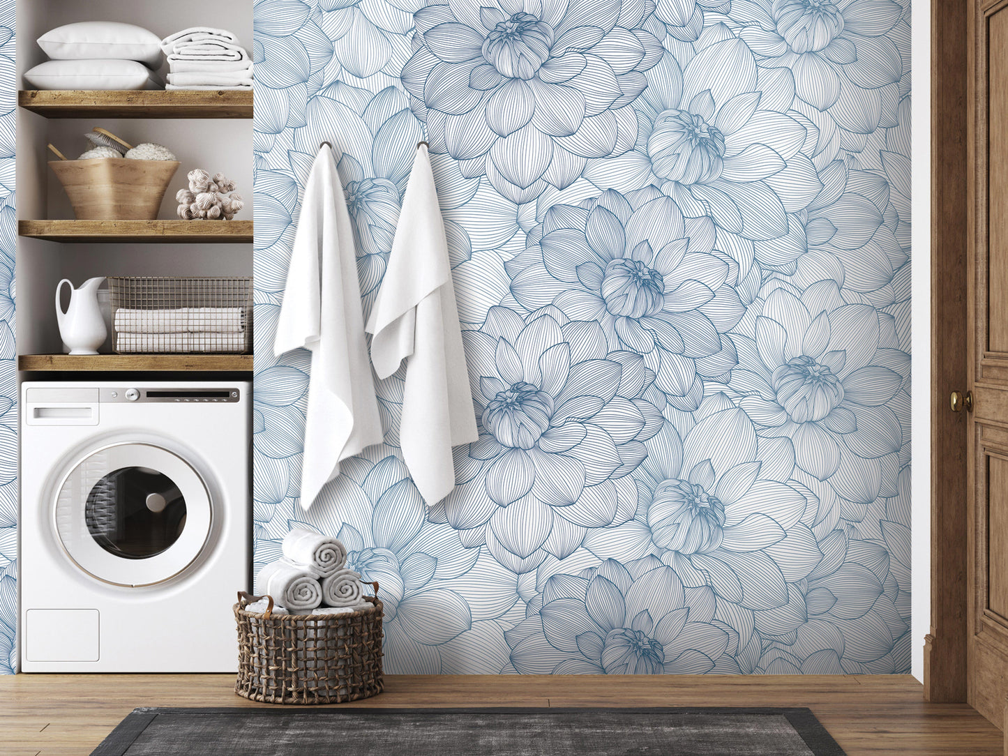 a bathroom with a blue and white floral wallpaper, a washing machine, and a basket of towels.