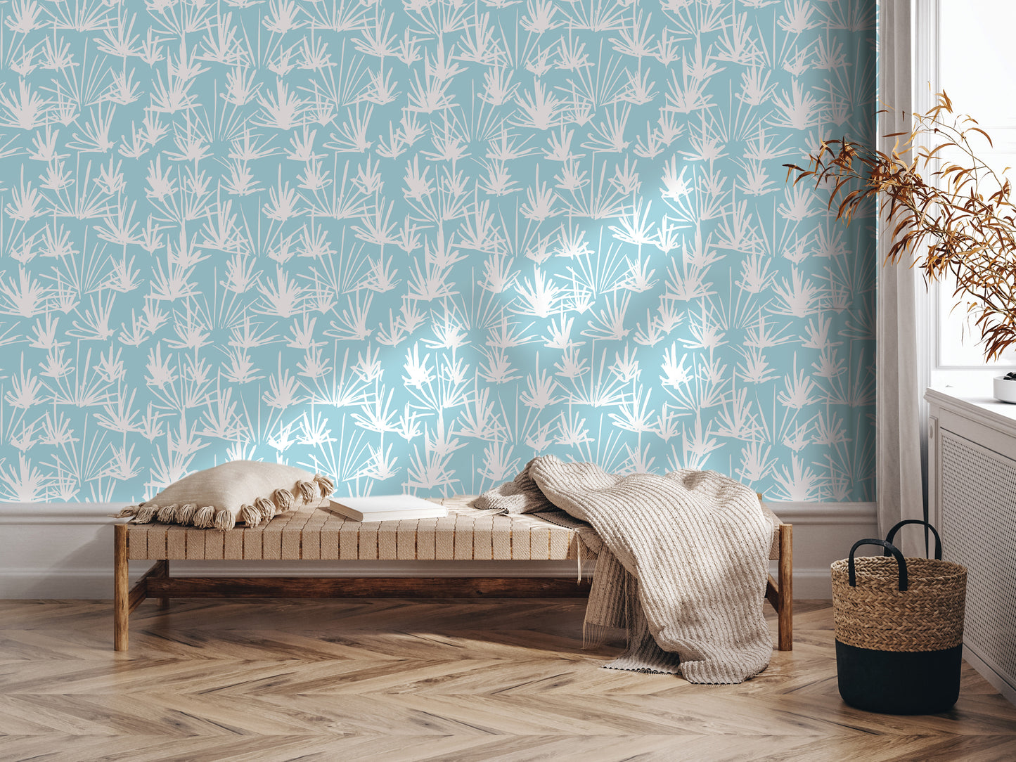 a modern living room with a blue and white patterned wallpaper, a wooden bench with a blanket draped over it, and a woven basket on the floor.