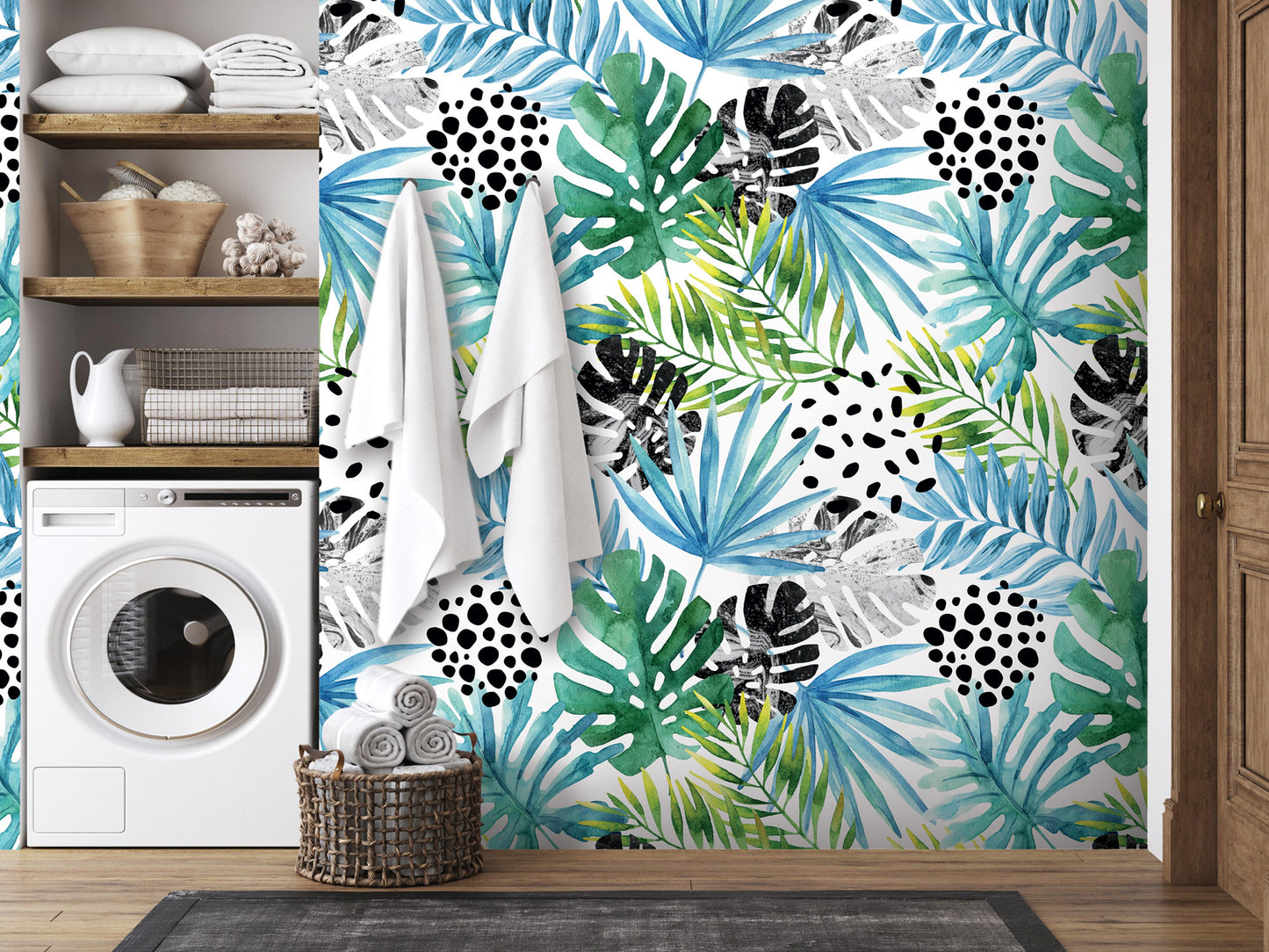 a bathroom with a tropical-themed wallpaper, a washing machine, and a basket of towels.