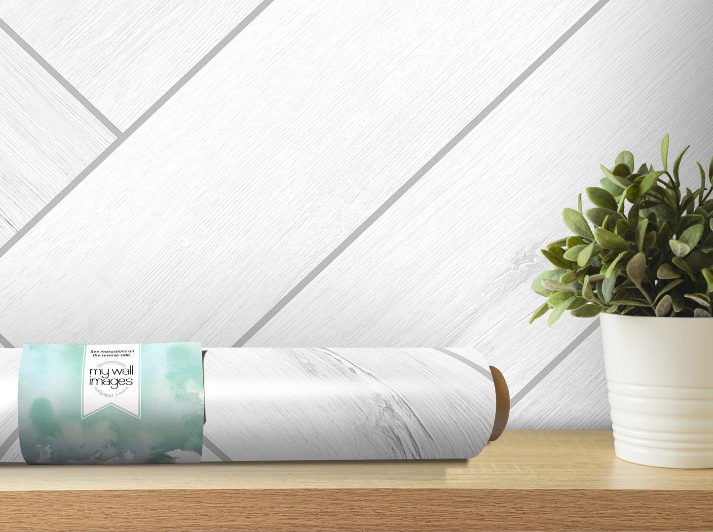 a white wall with a wooden shelf and a potted plant.