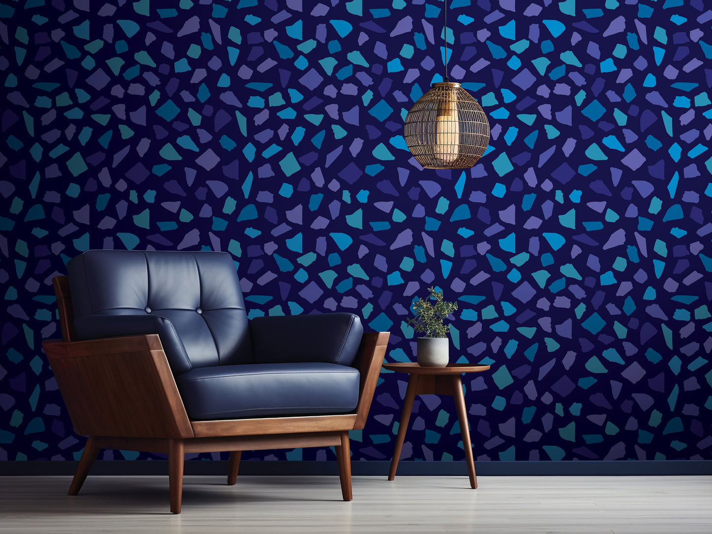 a modern living room with a blue leather armchair, a wooden side table, and a hanging light fixture. The wall behind the furniture has a mosaic pattern in shades of blue and purple.