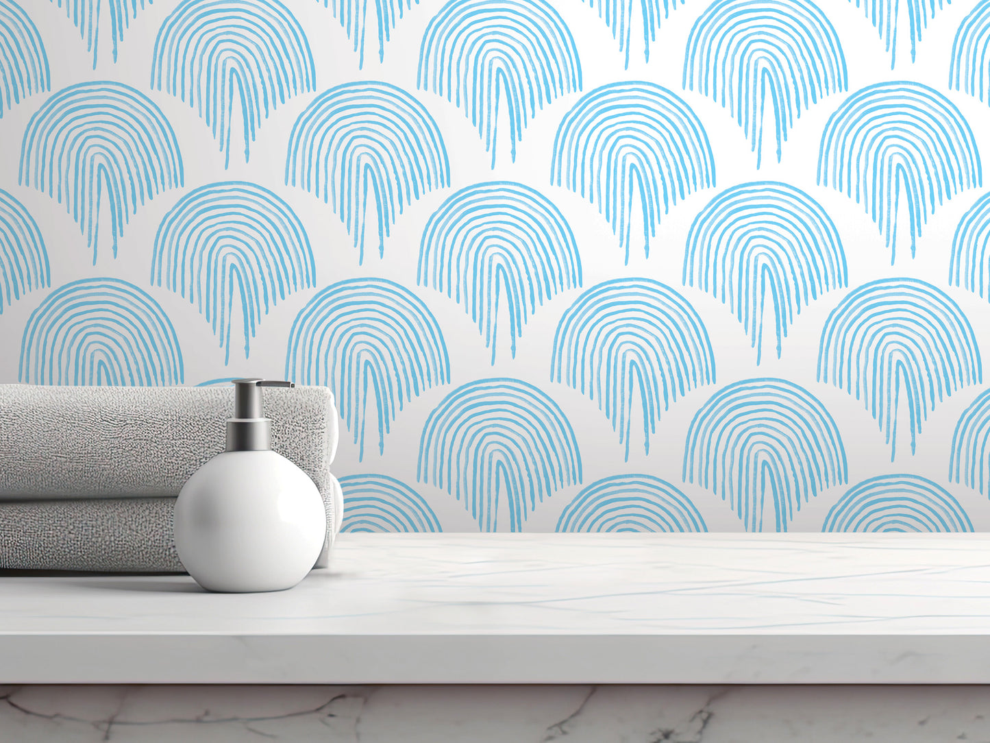 a white countertop with a white soap dispenser and a gray towel. The towel is neatly folded and placed on the countertop. The background of the image is a white wall with a repeating blue and white pattern.
