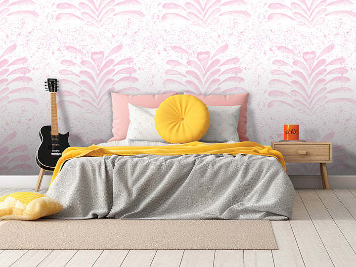 a bedroom with a bed, a guitar, and a nightstand. The bed has a gray comforter and a yellow throw pillow. The guitar is leaning against the wall, and the nightstand has a book and a mug on it. The wall behind the bed has a pink and white floral pattern.