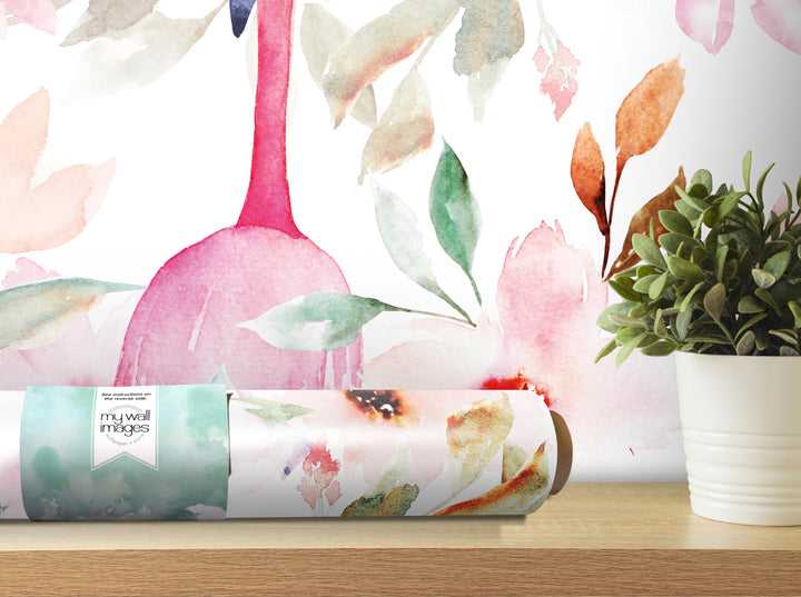 a wallpapered wall with a pink flamingo and a potted plant, along with a roll of wallpaper and a white pot with a plant on a shelf.