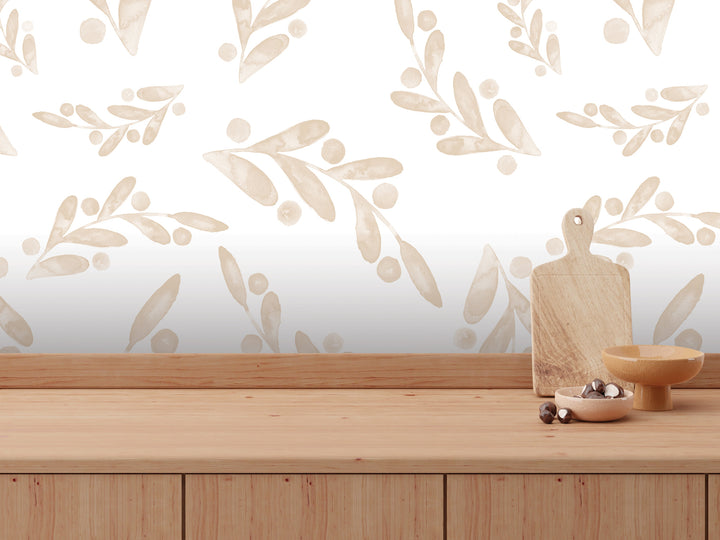 a wooden table with a bowl, a cutting board, and some small items on it, set against a wall with a repeating pattern of leaves and branches.