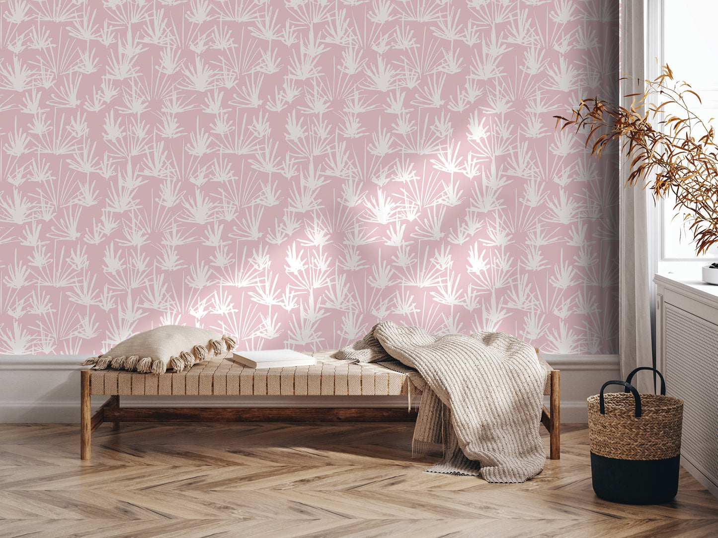 a cozy corner with a bench, a woven basket, and a plant, all set against a pink and white patterned wall.
