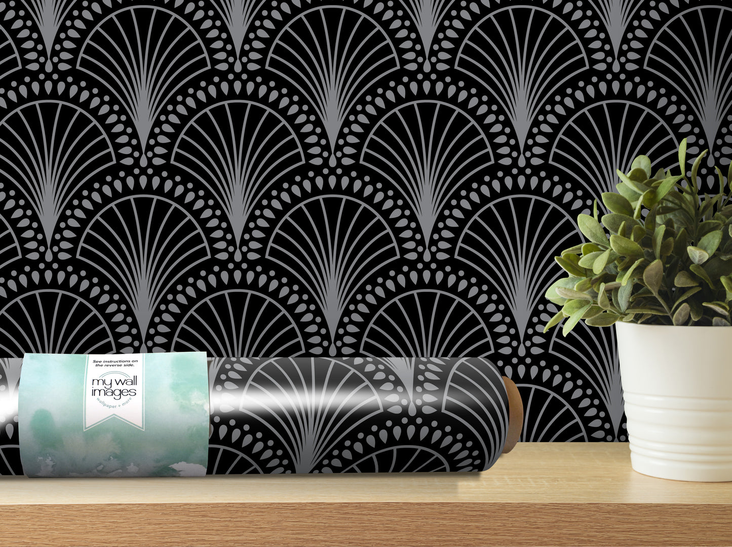 a black and white patterned wallpaper with a repeating fan-like design, and a potted plant placed on a shelf next to it.