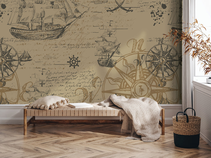 a room with a large wall mural depicting a nautical scene with ships, a compass, and other maritime elements. The room has a wooden floor, a bench, and a woven basket on the floor. There is also a plant in the corner of the room.