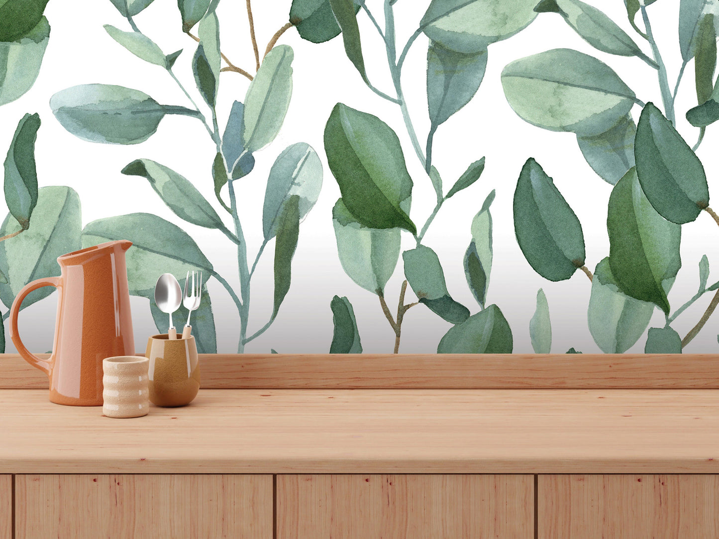 a wooden table with various items on it, including a pitcher, a small ceramic container, and a set of silverware. The background is a wallpapered with a repeating pattern of green leaves, creating a natural and serene atmosphere.