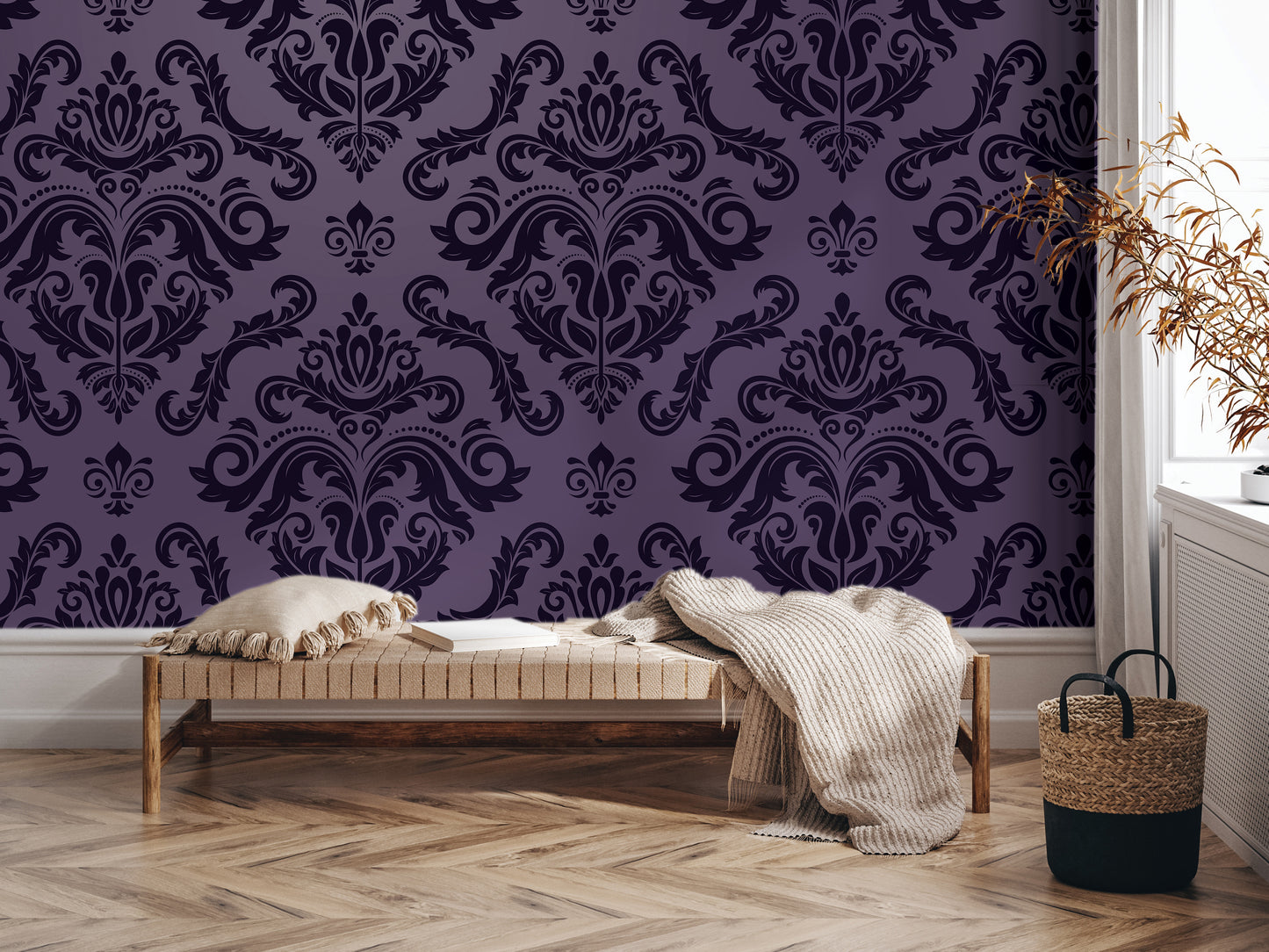 a cozy living room setting with a plush bench, a woven basket, and a decorative wall with a purple damask pattern.