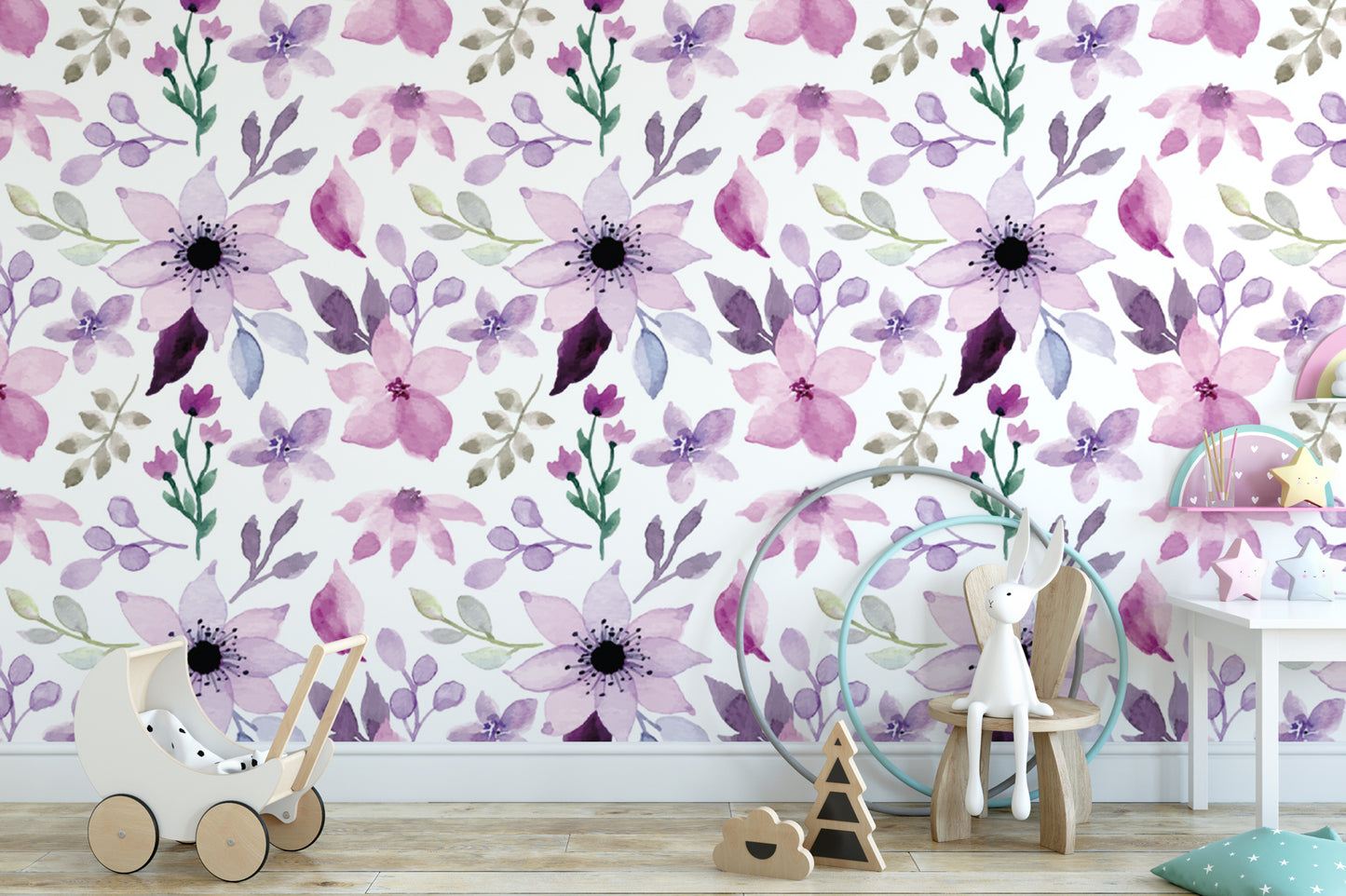 a room with a floral wallpaper, a wooden rocking chair, a wooden toy car, and a wooden toy horse.