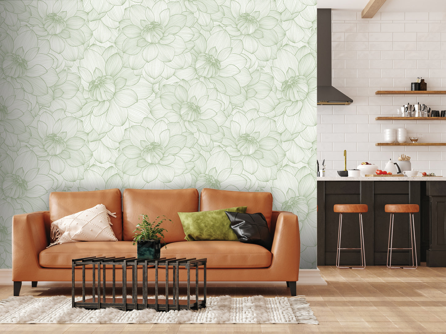 a modern living room with a large wallpapered wall featuring a floral pattern in shades of green and white. The room is furnished with a brown leather sofa, a black coffee table, and a wooden bar stool. A kitchenette with a countertop and shelves can be seen in the background, along with a potted plant and a vase.