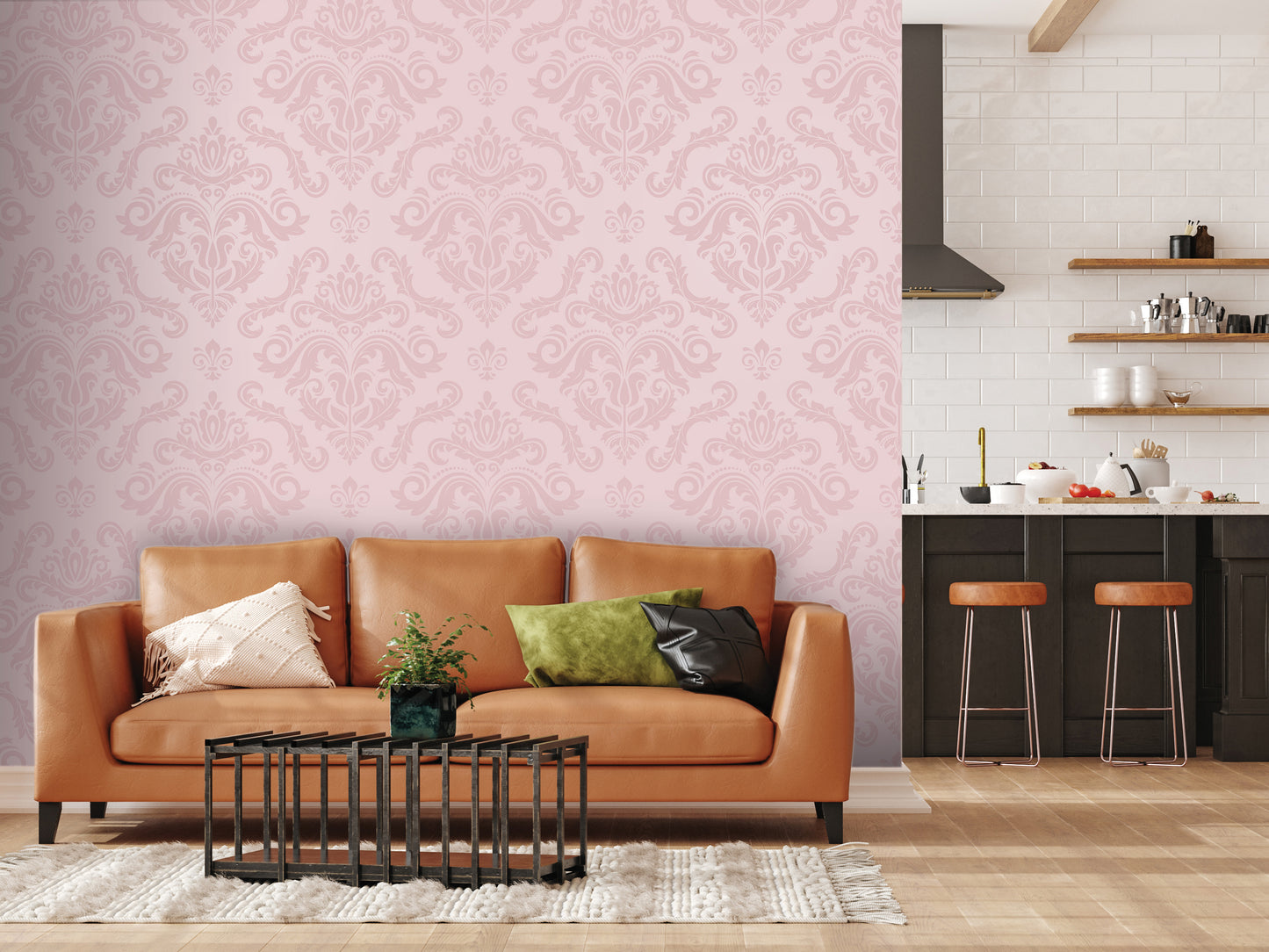 a living room with a brown leather sofa, a black coffee table, and a pink wall with a repeating pattern. The room also includes a kitchen area with a countertop, stools, and a sink.